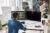 Developer at a desk with code editor and a St. Charles County